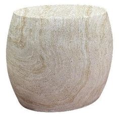 a large white vase sitting on top of a table