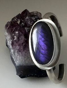 https://flic.kr/p/V9EhGR | Purple Labradorite Bracelet | Purple Labradorite Stone Set in Brushed Sterling Silver Purple labradorite sterling silversmith womens bracelet Silversmith Jewellery, Womens Bracelet, Labradorite Bracelet, Fine Silver Jewelry, Labradorite Jewelry, Silver Jewellery Sets, Big Rings, Ring Ideas