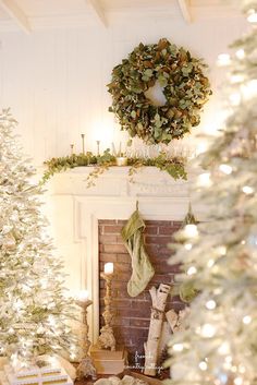 a fireplace decorated for christmas with stockings on the mantel