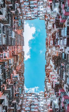 an aerial view of buildings with the sky in the background