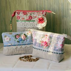 three purses with flowers and lace on them