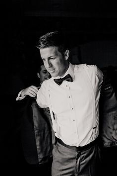 black and white photograph of a man in a tuxedo