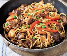 a skillet filled with beef and noodles