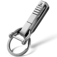 a metal keychain with a chain attached to it's center loop, on a white background