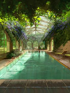 an indoor swimming pool surrounded by greenery and flowers on either side of the pool