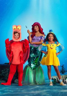 the little mermaids are all dressed up in their costumes and posing for a photo