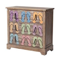 a wooden cabinet with flip flops painted on it