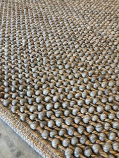 a close up view of a rug with balls on it