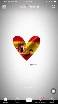 a heart with the flag of spain in it's center and an emoticive face