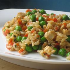 a white plate topped with rice and veggies