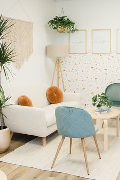 a living room filled with furniture and potted plants