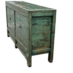 an old green wooden cabinet with two drawers