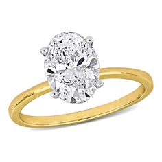 an oval cut diamond engagement ring in yellow gold