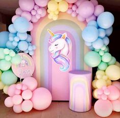 a unicorn themed birthday party with balloons and decorations