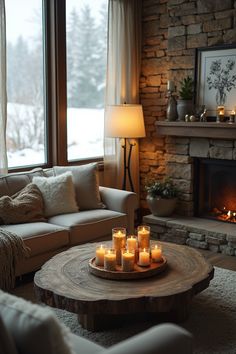 A charming winter living room featuring a stone fireplace, soft beige furniture, natural wood accents, and glowing candles for a warm, inviting atmosphere. #CozyLivingRoom #RusticHomeDecor #WinterVibes #FireplaceDesign #WarmInteriors