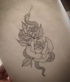 a drawing of a rose with a snake on it