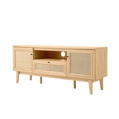 an entertainment unit with wicker doors and drawers