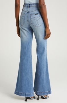 A high-rise waist and flared legs dial up the throwback charm of comfy organic cotton–blend jeans finished with a faded, vintage-inspired wash. 31" inseam, 24" leg opening; 11 1/2" front rise; 15 1/2" back rise (size 29) Zip fly with button closure Five-pocket style 99% organic cotton, 1% elastane Machine wash, line dry Imported Goth Glamour, Jeans Palazzo, Flare Leg Jeans, East Coast, Leg Jeans, Blue Jeans, Denim Jeans, Vintage Inspired, Organic Cotton