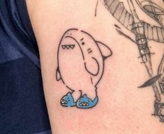 an elephant tattoo on the left arm