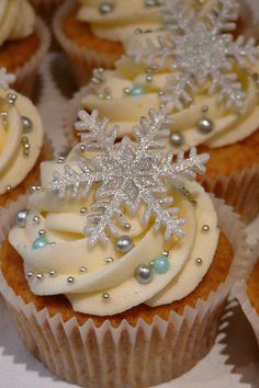 cupcakes decorated with frosting and snowflakes