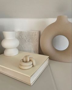 Bring your room to life with this modern minimalist white halo vase. This ceramic vase is versatile and can be filled with water for fresh flowers, used for dried pampas grass, eucalyptus or other dried floral arrangements. The design is simple, inspired by our everyday snack, a donut with the intention of making a fun yet elegant decor. - Interior decoration, flower vase, interior pieces, luxurious decoration, architectural digest, zara home, hm home Vase Interior, Luxurious Decoration, Round Flower, Minimalist White, Coffee Table Book, Minimalist Furniture