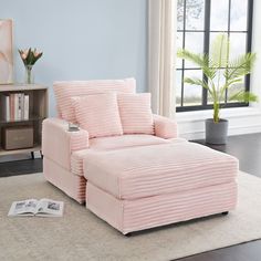 a pink chair and ottoman in a room