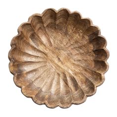 a large wooden bowl sitting on top of a table