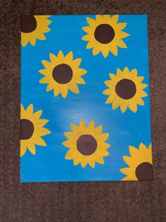 a painting with sunflowers painted on it