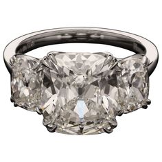 A stunning old-cut diamond and platinum three stone ring by Hancocks, set to the centre with an old mine brilliant cut diamond weighing 5.02cts and of G colour and VVS2 clarity between two further old mine brilliants of 1.03cts F colour and VS2 clarity and 1.01cts and G colour and SI1 clarity, all double-claw set in a finely handmade platinum ring with scalloped gallery and a plain D-shape band. Maker Hancocks Period Contemporary Origin London Gemstones 5.02ct G VVS2 old mine brilliant cut diamo Antique Engagement Rings Victorian, Dig Jewelry, Estate Jewelry Rings, Brilliant Cut Diamond Ring, Gia Certificate, Asscher Cut Diamond, Modern Engagement Rings, Contemporary Ring, Three Stone Ring