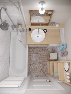 small bathroom with sink, toilet and bathtub next to shower stall in the corner