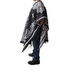 Material: Acrylic WoolColor: BlackStyle: Mexican Design: San JudasSize:Length: 192cm (75")Width: 112 cm (44")It refers to the total measurements of the poncho when it is fully open (like a blanket). Description: MEXICAN PONCHO Genuine Mexican Poncho for Men manufactured in Mexico. The Mexican Poncho is an iconic and versatile garment that has been part of Mexican culture and tradition for centuries. The colorful and artisanal designs of GAMBOA adult ponchos make them a garment that not only expr Poncho For Men, Mens Poncho, Alpaca Poncho, Poncho Pullover, Mexican Serapes, Artisanal Design, Mexican Designs, Mexican Culture, Cow Boy