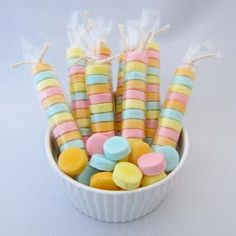 colorful candy candies in a white bowl