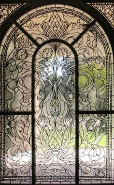 an ornate glass window that has been made to look like it is in the middle of a