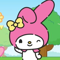 hello kitty is standing in the grass with her hands up to her head and wearing a pink hat