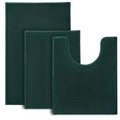 three dark green kitchen mats on a white background