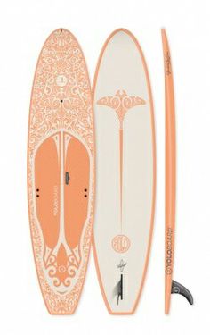 an orange and white surfboard next to a pencil