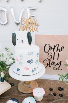 a white cake sitting on top of a wooden table