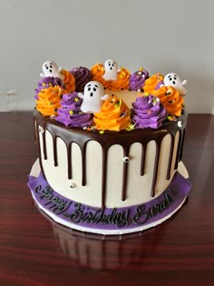 a cake decorated with icing and spooky decorations