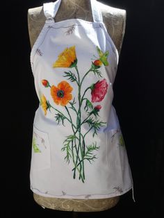 an apron with flowers painted on it