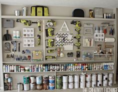 there are many different items on the shelves in this garage storage area that is organized and organized