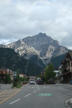 a street with mountains in the background