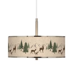 a light fixture with deer and pine trees on the drum shade, hanging from a ceiling fixture