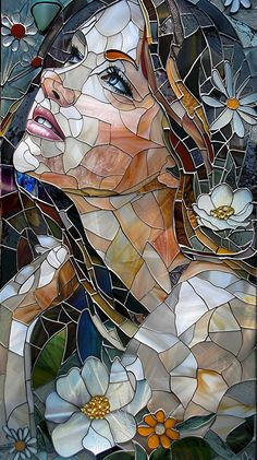 a woman's face is depicted in a stained glass window with flowers on it