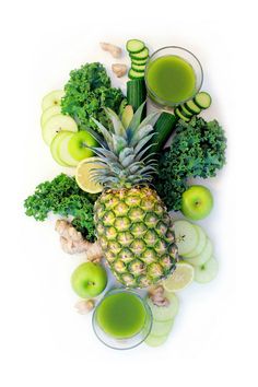 various fruits and vegetables are arranged in the shape of a pineapple, apple, broccoli, celery, cucumber