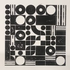 an abstract black and white design with circles, stripes, and rectangles on paper