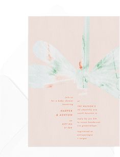 a pink and green wedding card with a dragonfly on the front in watercolor