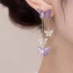 Description: Chic Butterfly Dangle EarringsSpecifications:Size: 5.5 cm * 1.4 cmWeight: 7 g/pairMaterial: Alloy, Bronze, Acrylic, Crystal, 14k goldColor: purple/blue Flutter your fashion flair with these Chic Butterfly Dangle Earrings! These playful earrings feature delicate butterfly dangles that add a touch of whimsy to any outfit. Perfect for expressing your unique style and adding a touch of fun to any look. Cute Dangling Earrings, Blue Earrings Aesthetic, Cute Dangle Earrings, Aesthetic Earrings, Princess Earrings, Crystal Butterfly, Magical Jewelry, Nickel Free Earrings, Daily Jewelry