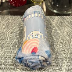 a rolled up blanket sitting on top of a table