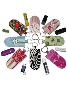 an assortment of various items are arranged in a circle on a white background, with one keychain attached to the other