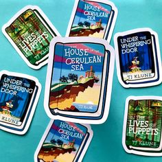 four stickers depicting the various types of houses and their floors on a blue surface